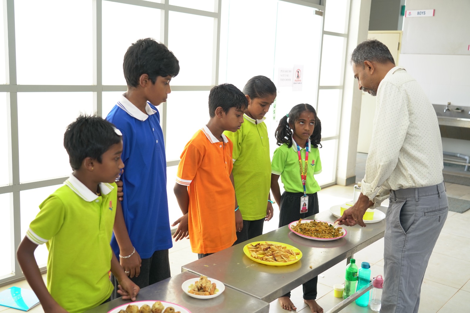 Students tasting freshly prepared culinary arts dishes