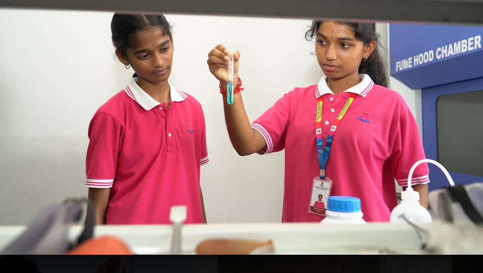 iLead students conducting a science experiment with a teacher