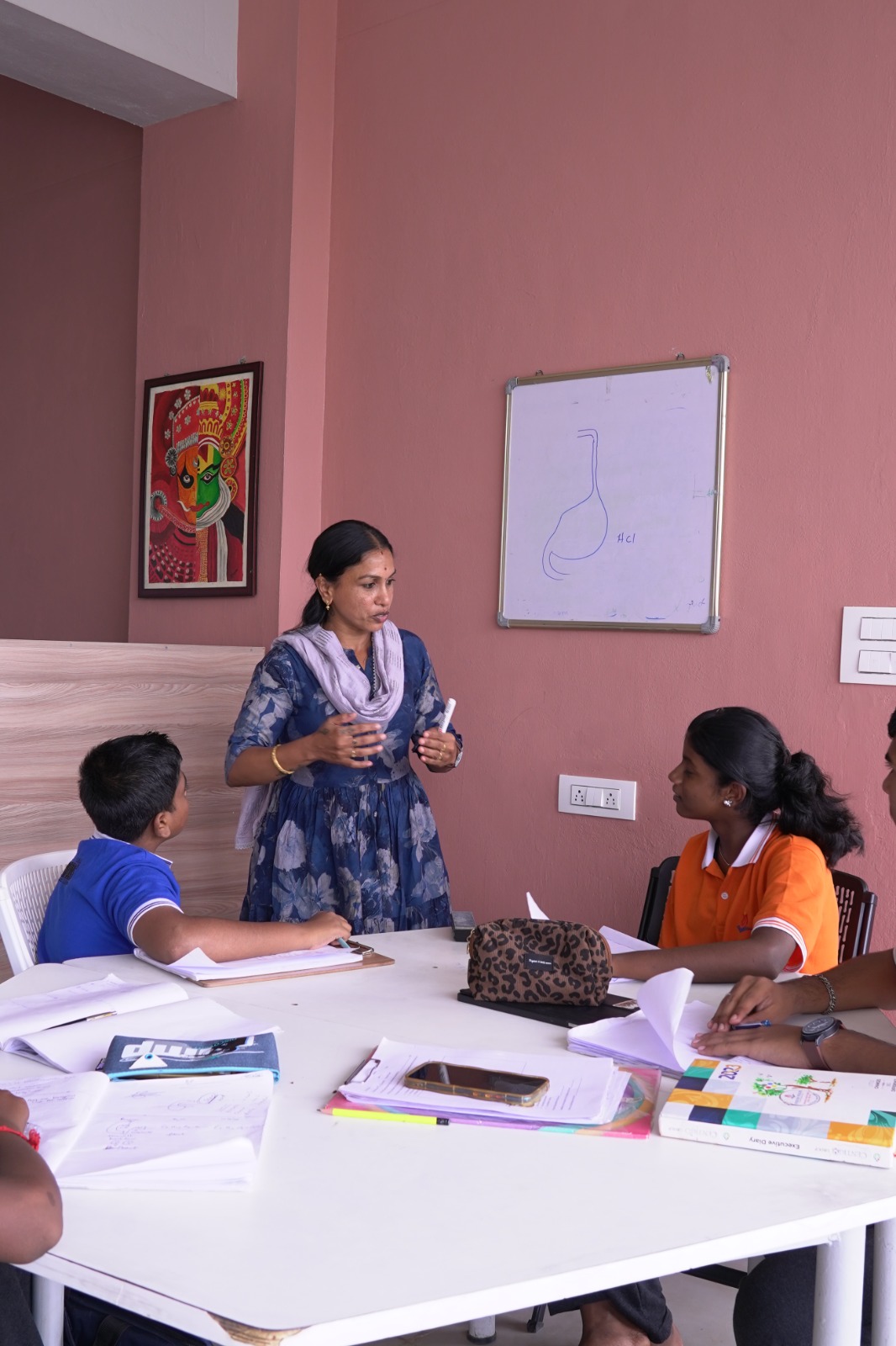 Teacher leading a discussion with students during Language Hour