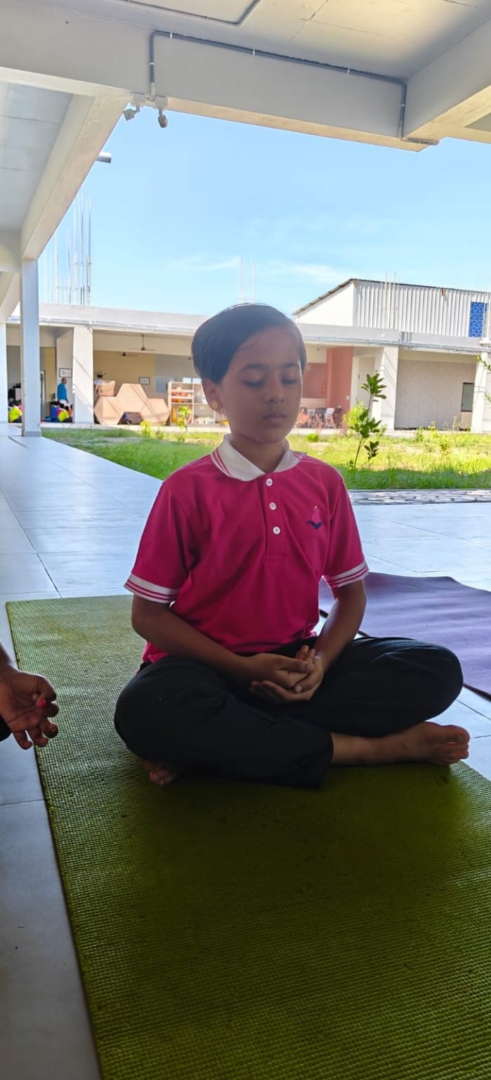 Student meditating outdoors during Smart Moves